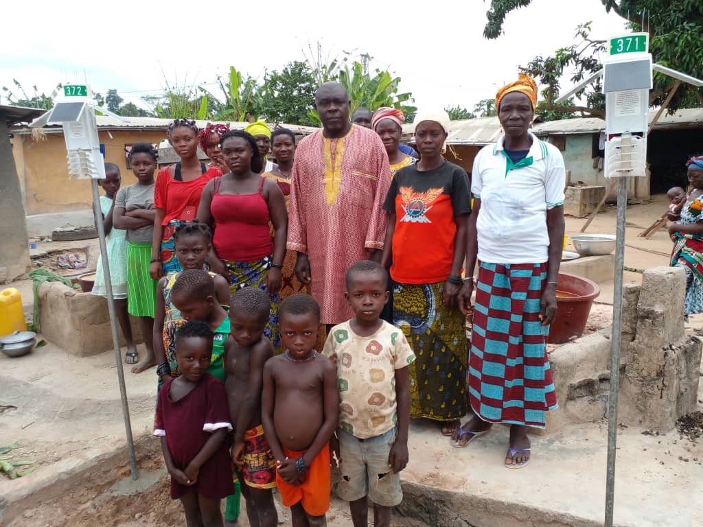 Community gathered around a Veriground weather station installation
